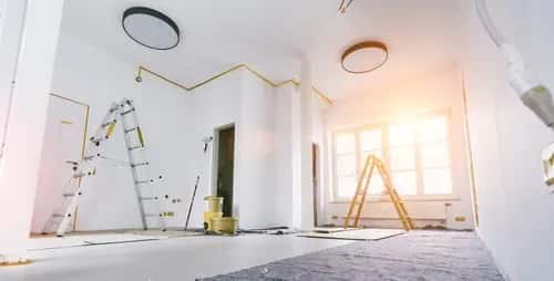 HEPA vacuum removing post-construction drywall dust from floor surface